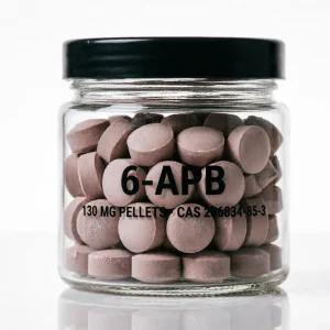 6-APB 130mg Pellets: dusty pink pressed pellets in a clear glass jar with black cap, name printed on the glass, white background.