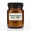 Flubromazepam pure powder in a premium amber glass jar on a clean white e-commerce background.